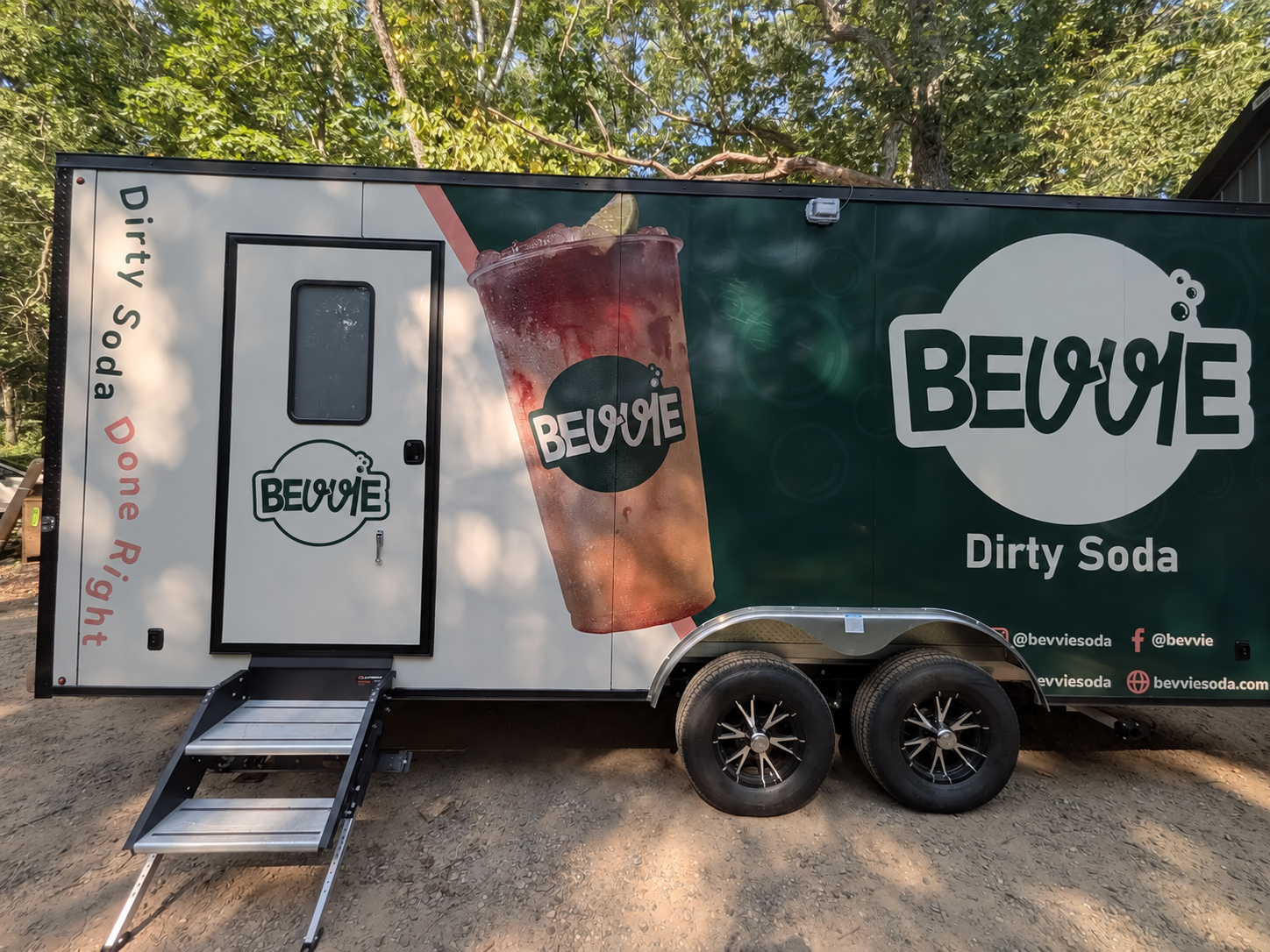 Bevvie trailer layout preview with its small logo centered below the entry-door window, clear of trim and hardware